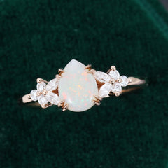 Pear Cut Opal Engagement Ring with Moissanite Blossom